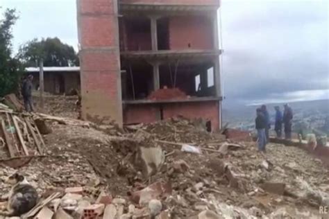 cleaning mud Bolivia|Landslide in Bolivia leaves residents without homes and electricity .